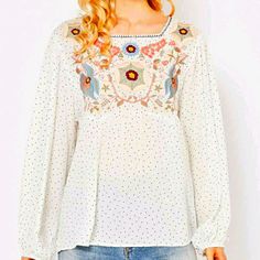 Beautiful Pastel Floral Embroidery On Pin Dot Polka Dot Top. An Absolutely Adorable Top. Elastic Arm Cuffs. 100% Rayon. Flowy Loose Fit. Bust: 18" Length 23" White Long Sleeve Embroidered Top With Floral Print, White Long Sleeve Top With Floral Embroidery, White Folk Embroidered Top With Floral Print, Arm Cuffs, Arm Cuff, Pastel Floral, Polka Dot Top, Floral Embroidery, Polka Dot