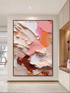 an abstract painting hangs on the wall in a room