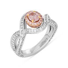 For the woman you adore, this sparkling diamond engagement ring proclaims her sophisticated style. Crafted in 99 platinum, this fashion-forward design showcases a shimmering oval cut fancy purplish pink diamond wrapped in a rose gold pink diamond halo. The lovely diamond-lined twist shank lends feminine appeal to the look. Set inside are beautifully equal cut pave diamonds for extra shine and dazzle. 
Available in all sizes, send us yours!
0.53 carat oval cut fancy purplish pink - GIA repor Luxury Pink Diamond Ring With Halo Design, Elegant Pink Diamond Ring In Platinum, Luxury Pink Halo Diamond Ring, Luxury Pink Diamond Ring With Brilliant Cut, Pink Oval Diamond Ring In Platinum, Exquisite Pink Diamond Ring With Accents, Luxury Pink Brilliant Cut Diamond Ring, Pink Oval Diamond Ring With Dazzling Style, Pink Oval Diamond Ring With Brilliant Cut