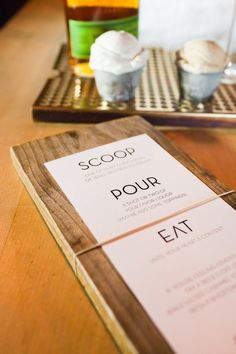 a menu sitting on top of a wooden table