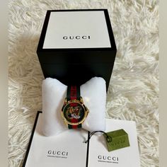 Gucci Watch Unisex Excellent Condition Complete Inclusion Gucci Gold Watch For Gift, Gucci Analog Watch Gift, Gucci Analog Watch As Gift, Gucci Analog Watches As Gifts, Gucci Analog Watches For Gift, Gucci Analog Watches As A Gift, Designer Red Watch As A Gift, Gucci Designer Watch As A Gift, Designer Gucci Watch As Gift