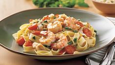 pasta with shrimp and tomatoes on a plate