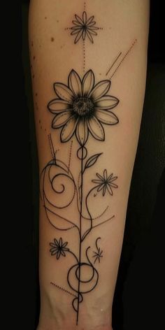 a black and white photo of a flower on the right side of the leg with swirls