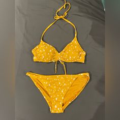 Spotted, Gold/Mustard Bikini. Never Worn, New Condition. Top Is Size Medium, Bottoms Are Size Large. Mustard Swimwear For Summer Poolside, Mustard Swimwear For Beach Season, Mustard Swimwear For Poolside In Summer, Mustard Swimwear For Summer Beach, Mustard Swimwear For Vacation Beach Season, Mustard Swimwear For Poolside And Beach Season, Mustard Beachwear Swimwear For Vacation, Mustard Fitted Swimwear For Summer, Fitted Mustard Swimwear For Summer