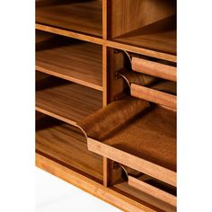 a close up of a wooden shelf with many shelves and drawers on it's sides