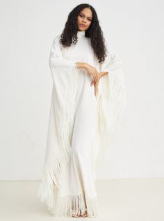 LIMITED EDITION Model Height: 177 CM 100% Polyester Length : 130cm With out fringe Elegant Long Sleeve Maxi Dress With Tassels, Luxury Long Sleeve Kaftan With Tassels, White Maxi Dress With Long Sleeves And Tassels, White Maxi Dress With Tassels, White Long Sleeve Maxi Dress With Tassels, Fringe Floor-length Maxi Dress, Cream V-neck Kaftan, Chic White V-neck Kaftan, White V-neck Embellished Kaftan