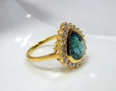 Emerald Ring, vintage18 K solid gold hallmarked, Natural emerald Diamond gemstone ring. Beautiful collection piece in very good condition. USA ring size -7.5 ( we can adjust size), size of top-16.5/15.5 mm, emerald weight-4 carat, diamond weight-0.63 carat VS G. Elegant Gold Pear-shaped Emerald Ring, Gold Teardrop Emerald Ring, Gold Emerald Pear-shaped Ring For Anniversary, Pear-shaped Gold Emerald Ring, Gold Emerald Pear-shaped Ring, Gold Pear-shaped Emerald Ring, Emerald Ring Vintage Antique, 22k Gold Bangles, Smaragd Ring