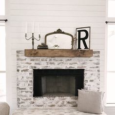 a living room filled with furniture and a fire place