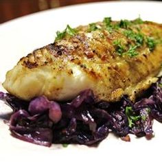 fish and purple cabbage on a white plate