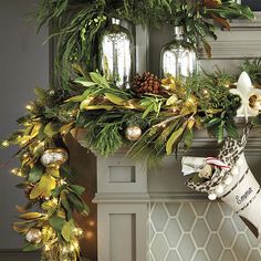 a christmas wreath is hanging on the mantle