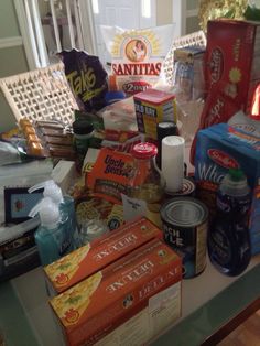 the table is full of snacks and other items for sale on it's side