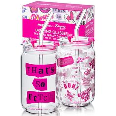 two clear glass jars with pink labels on them