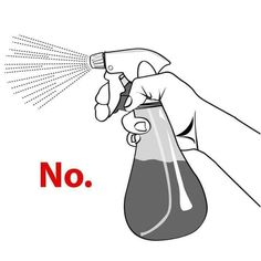 a hand holding a spray bottle with the word no on it