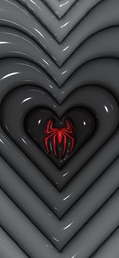 a heart shaped object with a spiderman symbol on it's center surrounded by black and red lines