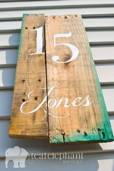 a wooden sign with the number fifteen on it