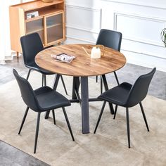 a round table with four chairs around it