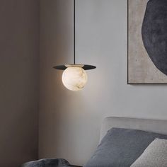 Add a modern touch to your bedroom with the Alabaster Sphere Pendant Light Above Bed. This stunning light is crafted from alabaster and hangs from a stylish metal handle. Enjoy the perfect amount of ambient lighting for a calming environment. Dimensions： Small: 10.2" D x 7.87" H(26cm D x 20cm H) Large: 15.7" D x 13.4" H(40cm D x 34cm H) 59"L cord will be provided, please contact us if you need more. Specification： Material: Metal, Natural Alabaster from Spain Finish: Brass (Optional: Black, Whit Light Above Bed, Lights Above Bed, Sphere Pendant Light, Calming Environment, Chrome Silver, Above Bed, Ceiling Light Fixtures, Ambient Lighting, Lead Time