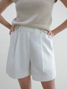 A complimentary piece to our Fauna Blazer, these shorts simply say: “classic and clean.” They are those basic white shorts you’ve been looking for—the ones you’ll wear to the park one day with a tee, and then the next day to a fancy event. The silhouette is flattering, and the length works for truly any occasion. Made of structured, yet soft linen, they also have adjustable buttons inside the waistband for your unique waistline. These are a go-to for years to come, reminding you that time is on Fancy Event, Lounge Party, Simple Tshirt, Wool Vest, Sleeveless Sweater, Workout Wear, Grey Sweater, The Park, Bright White