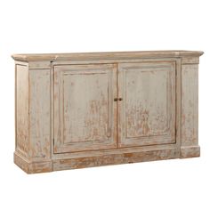 an old white cabinet with peeling paint on the doors and bottom part of it's door