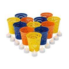 many different colored plastic cups with lit candles in front of each other on a white background