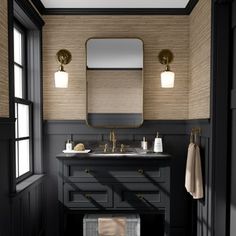 a black and white bathroom with two sinks