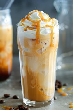 an iced drink with whipped cream and caramel drizzle