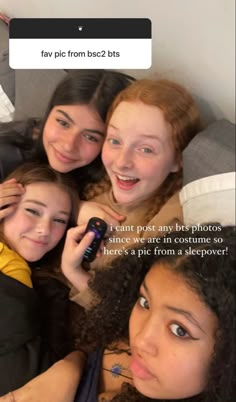 three girls are smiling and posing for the camera with their cell phones in front of them