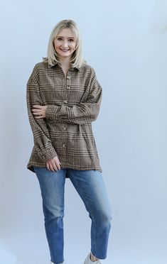 The Boone Day Plaid Brown Shacket is the ultimate cozy piece for your Fall and Winter wardrobe. The warm brown tones make this the perfect Fall festivity accessory! This shacket is detailed with long sleeves with buttons on the cuff, welt pockets, functional buttons, collar and a clean hem. Pair this shacket with your favorite mom jeans, boots and a basic white tee for a timeless and cozy look! - Runs true to size - Button down shacket - Long sleeves - Button on sleeve cuffs - Collar - Clean hem Brown Workwear Tops With Button Closure, Brown Button Closure Tops For Work, Brown Tops With Button Closure For Work, Brown Outerwear With Button Cuffs For Work, Brown Button Cuffs Outerwear For Work, Beige Long Sleeve Shacket With Buttoned Pockets, Oversized Brown Tops With Buttons, Brown Winter Shacket With Button Closure, Winter Brown Shacket With Button Closure