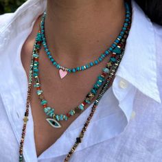 Turquoise Pink Love Choker Necklace is a beautiful addition to your style while bringing you love and protection. Jewelry reflects the wearer's personality, style and outlook to life. For this reason, I believe the jewelry we wear should be meaningful and have a unique and positive vibe. With the symbols of good luck, protection, and stones with powerful spiritual energy and vibration I use in my designs, you'll be embraced by positive vibes and zen energy while adding a stylish and unique touch Radiate Positive Energy, Pink Heart Pendant, Protection Jewelry, Spiritual Energy, Pink Turquoise, Pink Love, Love Symbols, Heart Pendant Necklace, We Wear