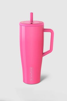 a pink coffee cup with a lid and handle is shown in front of a white background