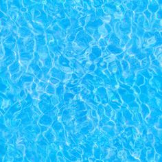 the water is blue and clear in this pool with no people or any objects on it