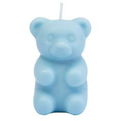 a blue bear shaped candle on a white background