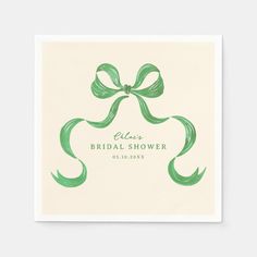 a white and green wedding shower napkin with a bow on the front that says, please bridal shower