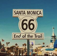 a street sign that says santa monica 66 end of the trail