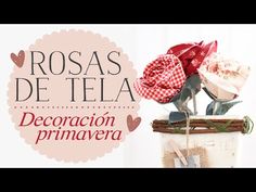 a cake decorated with flowers and ribbons on top of a wooden table next to a sign that says rosas de tela