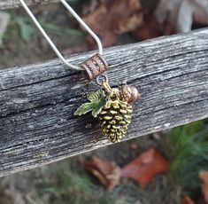 "This cute necklace would make a great gift. It has a gold colored pinecone charm, with a copper acorn and a green enamel leaf. The charm measures 1 1/4\" from the top of the copper bead to the bottom of the pinecone, and you can choose the length of the necklace. This would make a great gift for a birthday, an anniversary, Christmas or any other occasion. All jewelry items come in a gift box." Pinecone Necklace, Pinecone Pendant, Acorn Necklace, Autumn Necklace, Personalized Cufflinks, Dainty Gold Necklace, Handmade Jewelry Gift, Fall Jewelry, Themed Jewelry