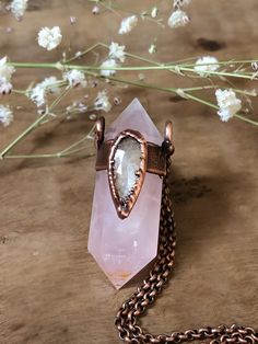 "This necklace feature a double terminated pink rose quartz point adorned with a beautiful silky sapphire gemstone. The pendant was electroformed with pure copper, oxidized with a dark patina, polished and finished with wax. ✨All my jewelry and designs are handmade by me with love and passion for art and nature✨ ︎>> NOTE: \"One of a Kind\" You'll receive this exactly piece  Created with: *double terminated pink pale rose quartz point *silky sapphire rose cut gemstone *pure copper *soldered antique copper chain *lobster clasp *pendant approx. 1 3/4\" inches *pendant is hanging from 17\" *please choose your desired length from 14-20 inches ︎>> ❀ ๑ ▲Rose Quartz It is known as the \"love stone\" as the message it emits is the strong vibration of unconditional love, joy, peace, warmth and heali Rose Gold Spiritual Crystal Gemstone Necklaces, Bohemian Electroformed Rose Gold Necklace, Copper Electroforming, Quartz Crystal Jewelry, Boho Jewels, Energy Jewelry, Quartz Crystal Pendant, Witchy Jewelry, Moonstone Jewelry