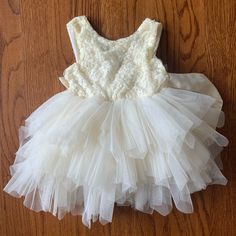 Reposhed! Ordered For My Daughter For A Wedding But She Wasn’t Able To Attend. Never Worn By Us! Sleeveless Ruffled Tutu Dress For First Communion, Princess Style Cream Tutu Dress For Spring, Spring Princess Cream Tutu Dress, Spring White Tutu Dress With Lace Bodice, Cream Ruffled Tutu Dress For Spring, Spring Cream Ruffled Tutu Dress, Cream Tulle Dress For Dress-up, Spring Baptism Dress In Tulle, Spring Tulle Baptism Dress