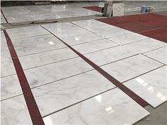 white marble tiles laid out on the ground