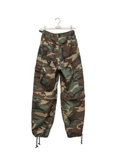 A cargo style wide leg trouser in maxi length. Camouflage color. Pocket details. Made in 100% cotton material. Model is in MINUSEY S. ✔️ Free worldwide express shipping over $100✔️ Loved by 6,500+ customers✔️ Limited edition collections, maximum styleStay ahead of the trend with can’t-find-anywhere-else staples. Your closet will thank you 💕 * MINUSEY S = EU 34, US 2* MINUSEY M = EU 36, US 4* 100% Cotton* Dry clean* Made in Korea - Model Height: 169cm/5'6" (US2, EU34) Camouflage Cotton Cargo Parachute Pants, Utility Camouflage Cotton Parachute Pants, Camouflage Cotton Utility Parachute Pants, Fall Combat Wide Leg Cargo Pants, Military Style Full Length Cargo Pants For Fall, Fall Military Style Full Length Cargo Pants, Military Full Length Cargo Pants For Fall, Fall Military Full Length Cargo Pants, Military Style Wide Leg Khaki Parachute Pants