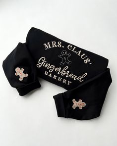 Black and gold embroidered ginberbread sweatshirt, with little gingerbread motif on each sleeve Cosy Season