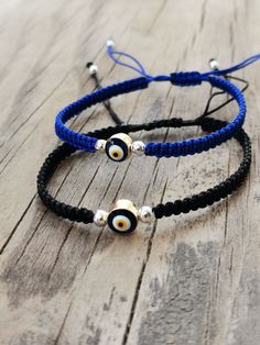 Evil eye bead  is used on my bracelet. The bracelet is macrame hand knit and has a sliding closure on the back. Although it is a stylish jewelry that you can use very comfortably in your daily life, it removes negative energy and attracts good luck thanks to the evil eye bead on it.  Keep away from chemicals to avoid damage to the product.  Our bracelets are adjustable for all wrists (from 19 to 31 cm - from 6'' to 11'').  The Evil Eye Bead is about 0.5 cm long. Adjustable Spiritual Braided Bracelet With Evil Eye, Adjustable Braided Evil Eye Bracelet For Spiritual Protection, Adjustable Spiritual Evil Eye Braided Bracelet, Bohemian Braided Bracelet With Evil Eye For Friendship, Adjustable Evil Eye Friendship Bracelet, Handmade Adjustable Braided Bracelets, Handmade Adjustable Braided Round Bracelets, Bohemian Evil Eye Bracelet With Adjustable Cord, Handmade Adjustable Evil Eye Bracelet For Friendship