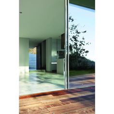 an open door leading to a kitchen and living room with wood flooring on the outside