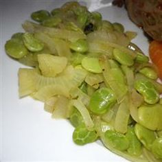 some vegetables are sitting on a white plate