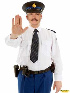 a man in uniform is holding his hand up