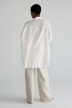 Crafted with 100% linen, this Oversized Shirt is the perfect piece to add to your collection of wardrobe staples. Made from a lightweight fabric, this piece ensures maximum comfort that is accentuated by the oversized fit. A perfect staple for your staycation or European summer vacation. Minimalist White Outfit, Linen Blouse With Shirttail Hem For Daywear, Versatile Linen Blouse For The Beach, Versatile Linen Blouse For Beach, Chic Linen Shirt With Shirttail Hem, Oversized Linen Tunic For Daywear, White Linen Tunic For Daywear, White Linen Blouse With Shirttail Hem, Neutral Linen Shirt With Relaxed Fit