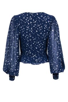 You'll be seeing stars in this flashy Yumi Kim blouse! Made with a sparkly star print and adorable peplum hem, this posh patriotic piece is perfect for a Fourth of July or Memorial day soiree! Style with white shorts and a bold red lip and you'll be all set for fireworks and hotdogs. Size S 100% Polyester Concealed side zipper Lined body Fitted silhouette V-neckline Long sleeve Star print design Faux buttons on front Peplum hem Bust 35" Waist 27" Sleeve length 28" Shoulder to hem 19.5" Fitted Star Print Tops For A Night Out, Fitted Star Print Top For Night Out, Star Print Tops For Night Out In Spring, Fitted Long Sleeve Tops With Star Print, Summer Tops With Star Print For Night Out, Spring Party Tops With Star Print, Fitted Star Print Tops For Fall, Fitted Tops With Star Print For Fall, Fitted Blue Top With Star Print