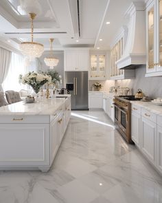 a kitchen with marble floors and white cabinets