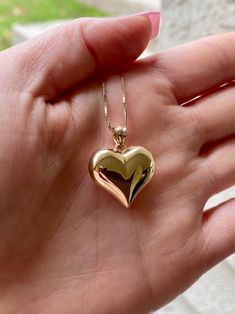 14k beautiful gold puffed heart love pendant. Material: Genuine 14k solid gold. Length: From top the bail to the bottom of the heart is approximately 1 inch long. Width: Approximately .80 inches wide. Weight: approximately 2.1 grams. *Chain sold separately* chains purchased with this order is approximately 1.5 grams* Comes in a nice box. 14k Gold Heart Pendant Necklace For Anniversary, 14k Gold Heart Necklace With Charms, 14k Gold Polished Heart Pendant Necklace, 14k Gold Pendant Heart Necklace With Polished Finish, 14k Gold Polished Finish Heart Necklace, 14k Gold Heart Necklace With Polished Finish, Polished 14k Gold Heart Necklace, Gold Heart Pendant Necklace With Polished Finish, 14k Heart Pendant Necklace For Valentine's Day