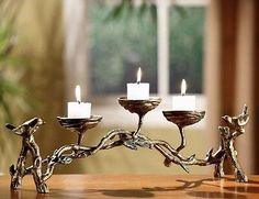 a candle holder with three candles on it